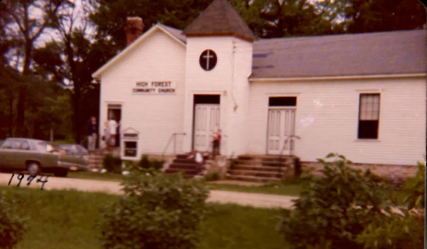 Color photograph of the church in 1974 with a new roof on the bell tower
